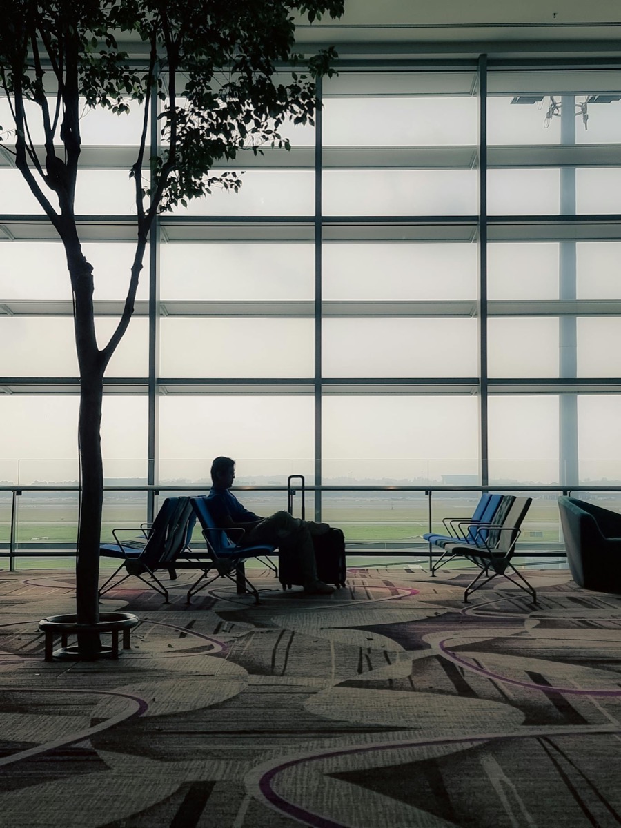 A traveller with a suitcase at an Australian airport