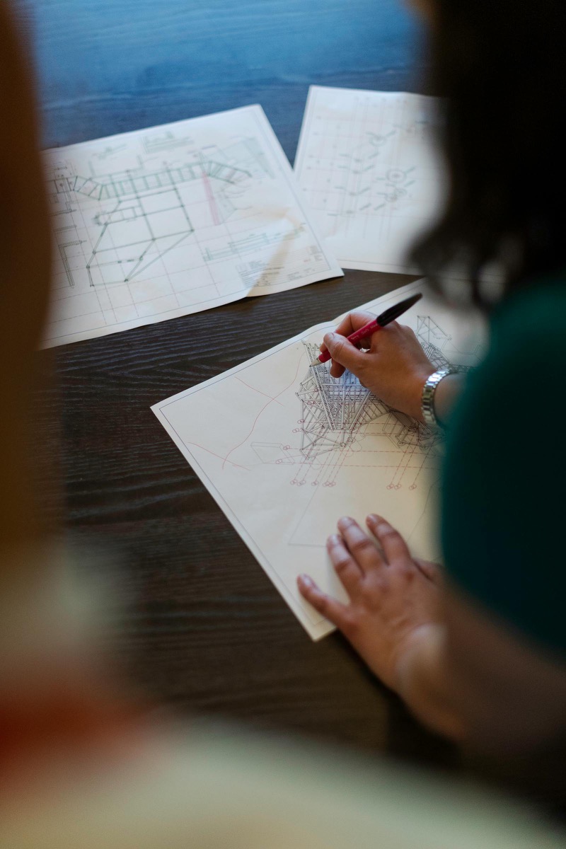 An assessor reviewing technical documents for a skills assessment