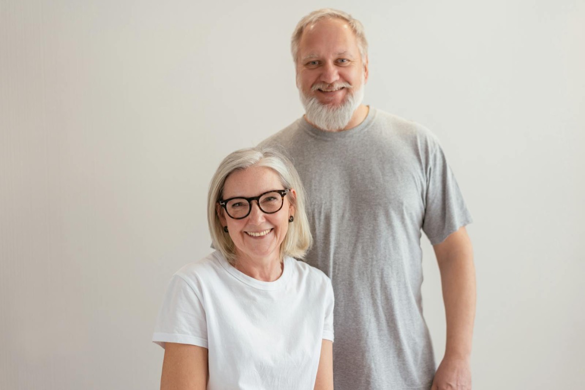 A senior couple smiling warmly