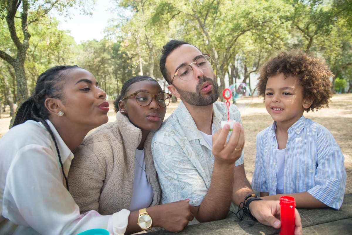 A multicultural family spending time together in a park
