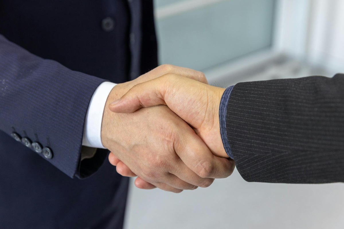 A professional handshake between business partners